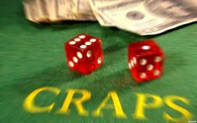 Evolution Gaming live-dealer studio with professional croupier hosting a baccarat table on tarikbos